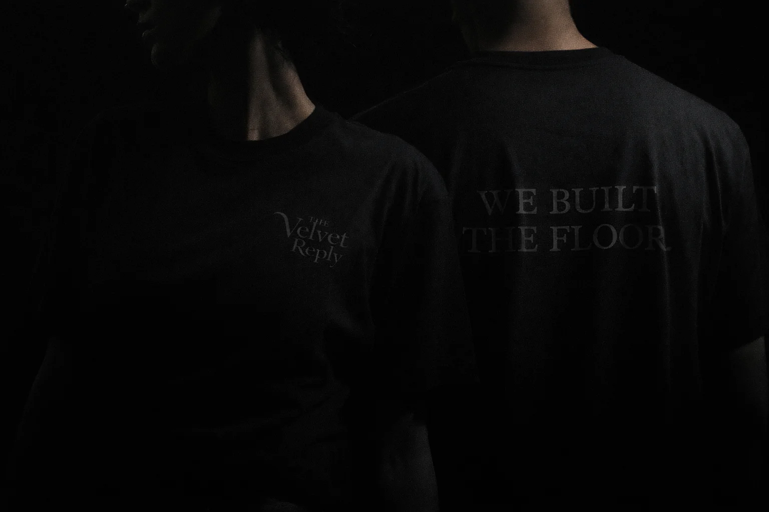 Black T-shirt with We Built The Floor text on back
